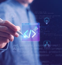 A person using a stylus to code on a digital interface, surrounded by AI and programming graphics in a tech-themed environment.