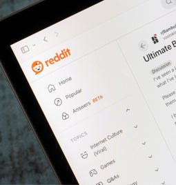 Laptop screen showing Reddit homepage