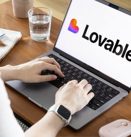 A person typing on a laptop displaying the 