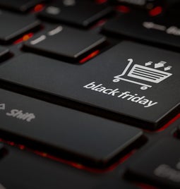 Close-up of a black keyboard highlighting a key labeled 