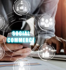 Person hand using smart phone with social commerce icon on virtual screen background