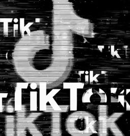 Fragmented TikTok logo against a black background