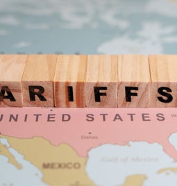 A closeup of the US on a map with letter blocks spelling 