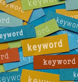 Snippets of colored paper with the word 