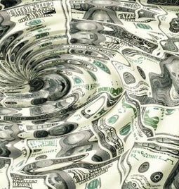 US dollars distorted by a water whirlpool