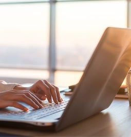 photo of hands typing on a keyboard